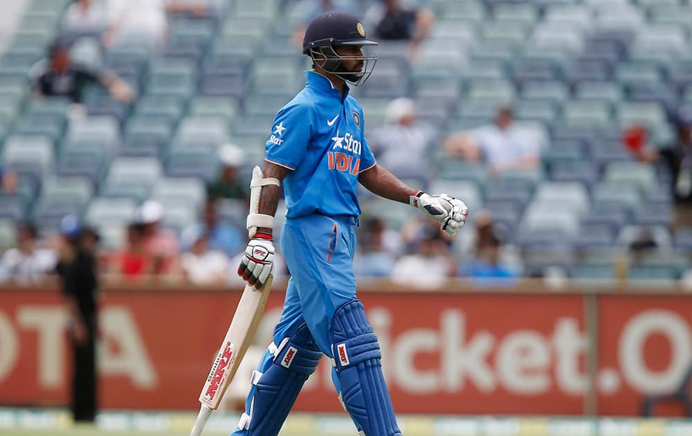 Shikhar Dhawan, heads back to the pavilion after being caught behind for 38 during their one-day international cricket match against England in Perth.