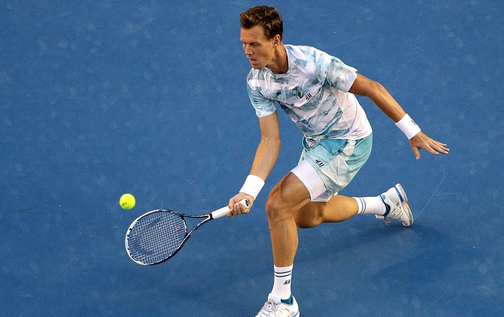 Tomas Berdych of the Czech Republic reaches for a shot to Andy Murray of Britain during their semifinal match at the Australian Open tennis championship in Melbourne.