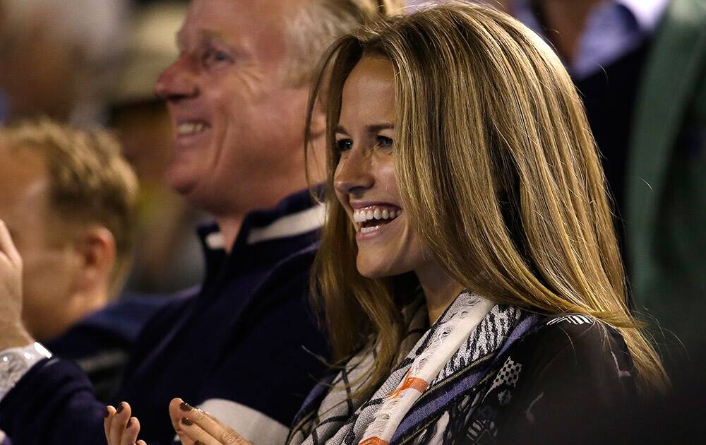 Kim Sears, fiancee of Andy Murray of Britain applauds after Murray's semifinal win over Tomas Berdych of the Czech Republic at the Australian Open tennis championship in Melbourne.