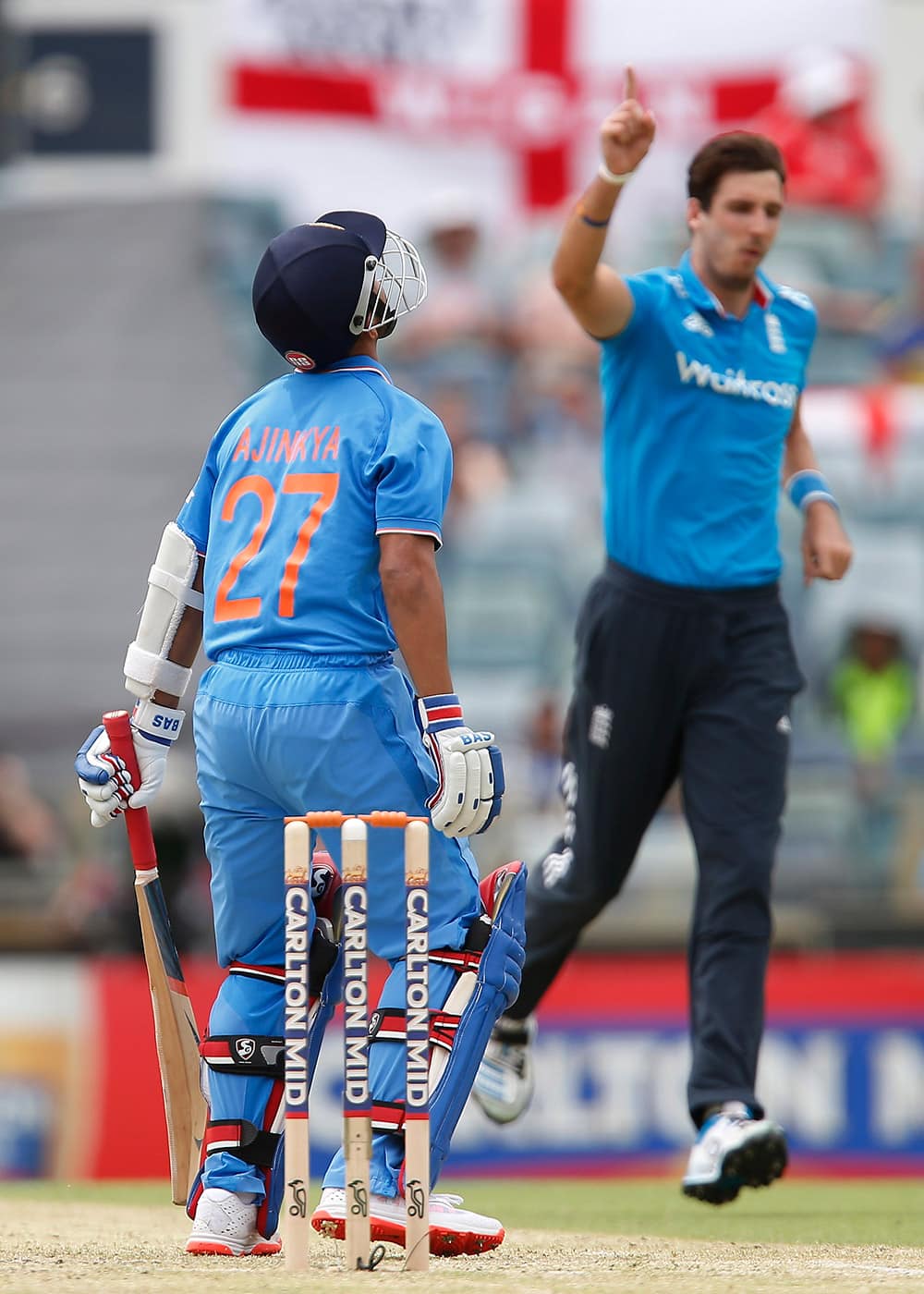 Ajinkya Rahane reacts after being caught behind for 73 runs off the bowling of England's Steven Finn during their one day international cricket match in Perth, Australia.