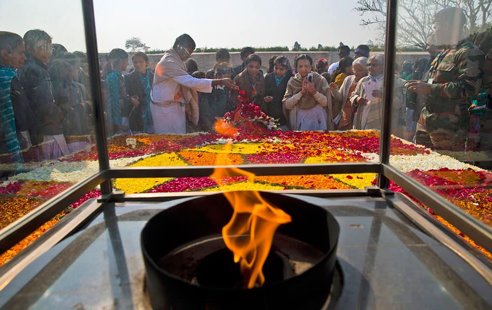 People pay their respect at Rajghat, a memorial to Mahatma Gandhi, on his death anniversary in New Delhi.