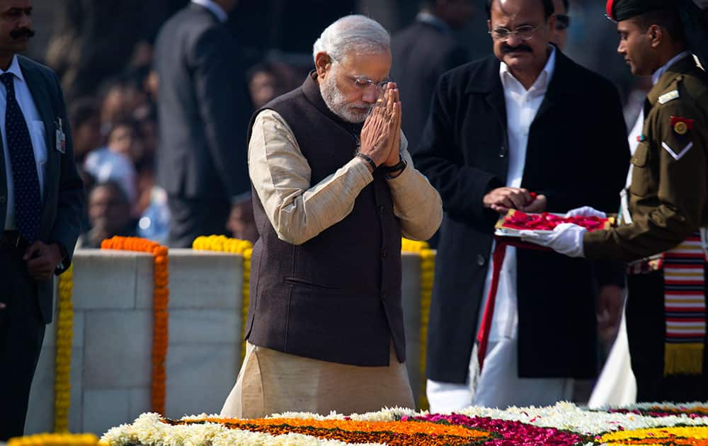 Prime Minister Narendra Modi pays his respect at Rajghat, a memorial to Mahatma Gandhi, on his death anniversary in New Delhi.