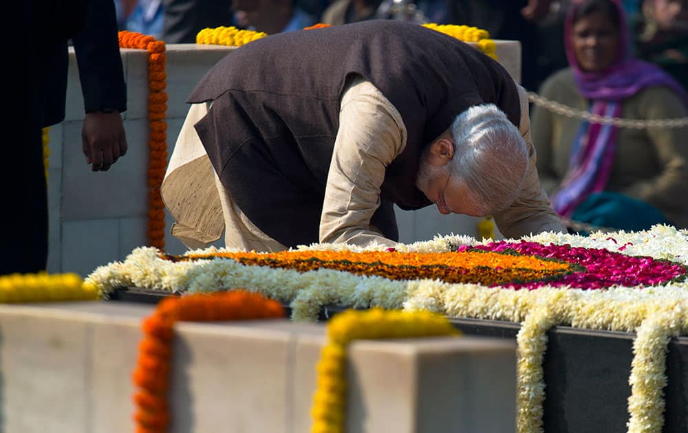 Prime Minister Narendra Modi pays his respect at Rajghat, a memorial to Mahatma Gandhi, on his death anniversary in New Delhi.