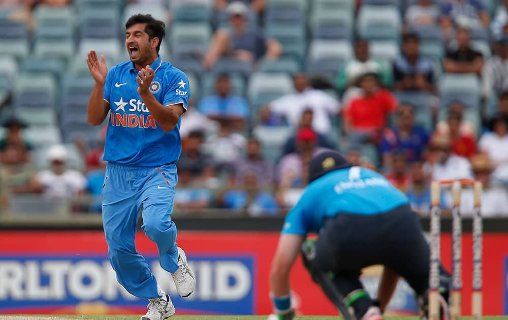 Mohit Sharma, celebrates after dismissing England's Ian Bell, lbw during their one day international cricket match in Perth, Australia.