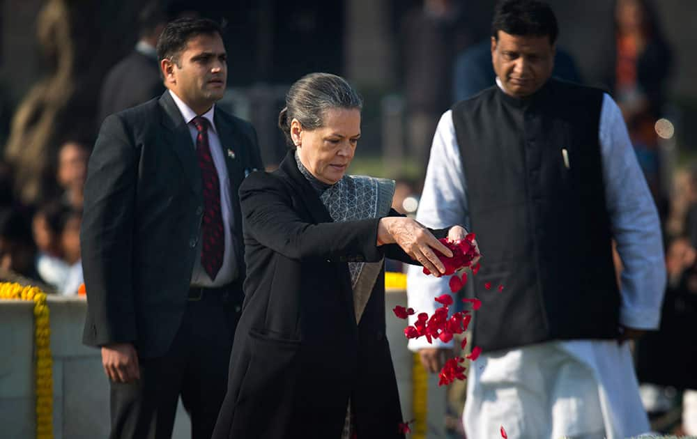 Congress party President Sonia Gandhi offers floral tributes at Rajghat, a memorial to Mahatma Gandhi, on his death anniversary in New Delhi.