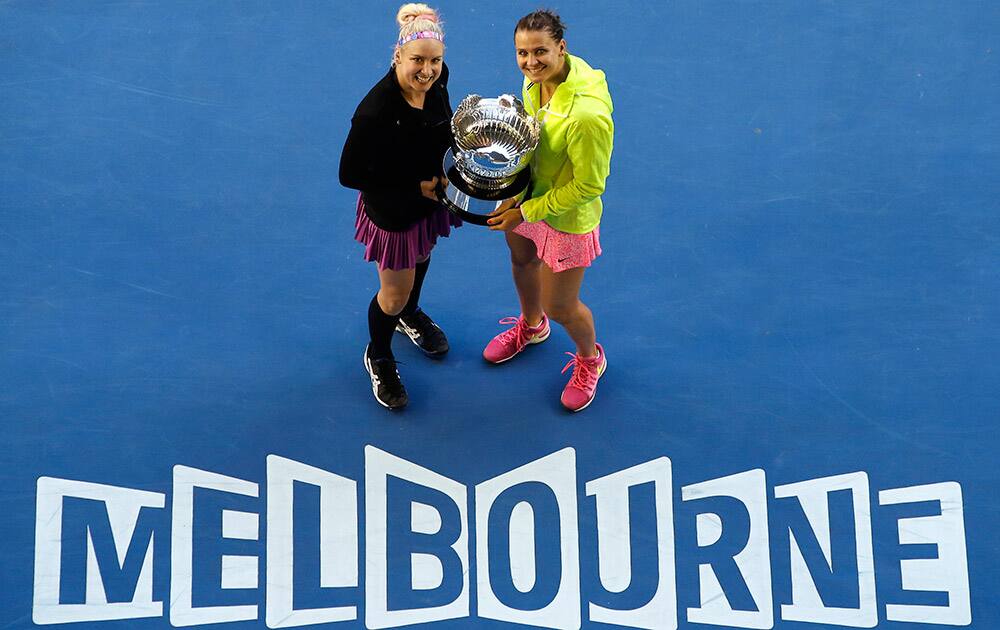 Bethanie Mattek-Sands of the U.S. and Lucie Safarova of the Czech Republic pose with the trophy during the awarding ceremony, after defeating Taiwan’s Chan Yung-jan and China’s Zheng Jie in their women’s doubles final at the Australian Open tennis championship in Melbourne, Australia.