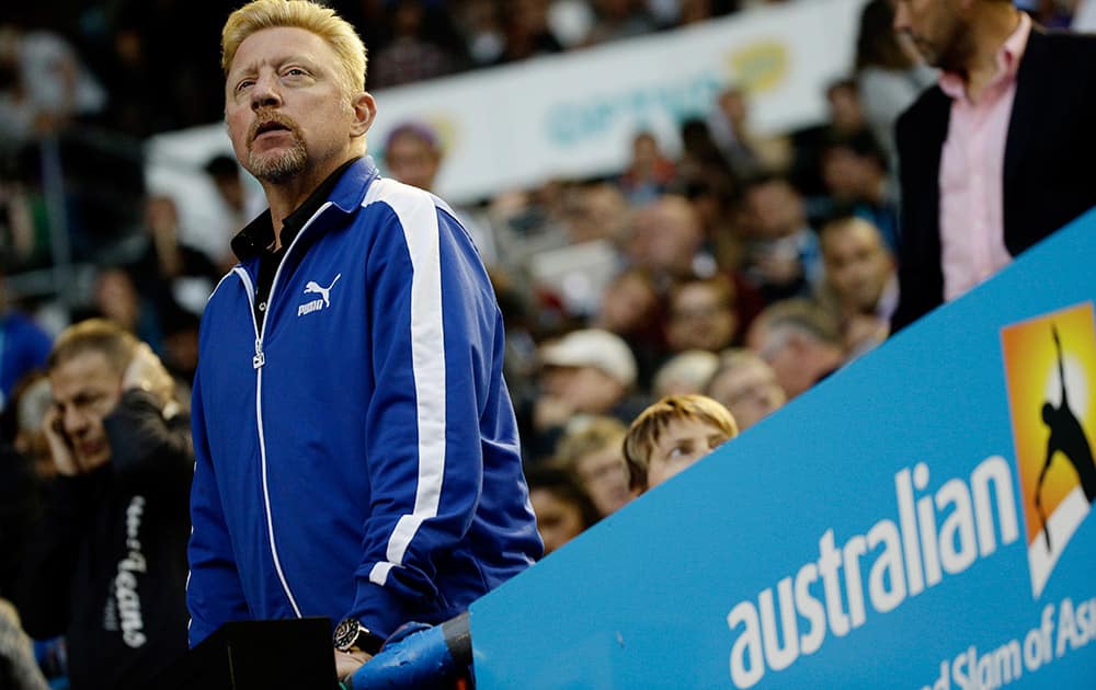 Boris Becker, coach of Novak Djokovic of Serbia watches the semifinal against Stan Wawrinka of Switzerland at the Australian Open tennis championship in Melbourne, Australia.