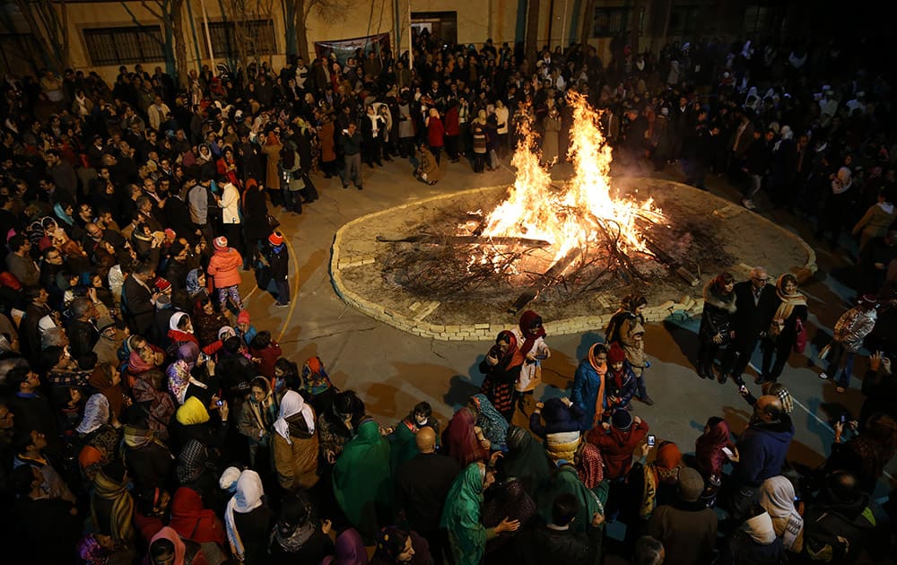 Iranian Zoroastrians gather around a giant bonfire in a ceremony celebrating their ancient mid-winter Sadeh festival in Tehran, Iran.