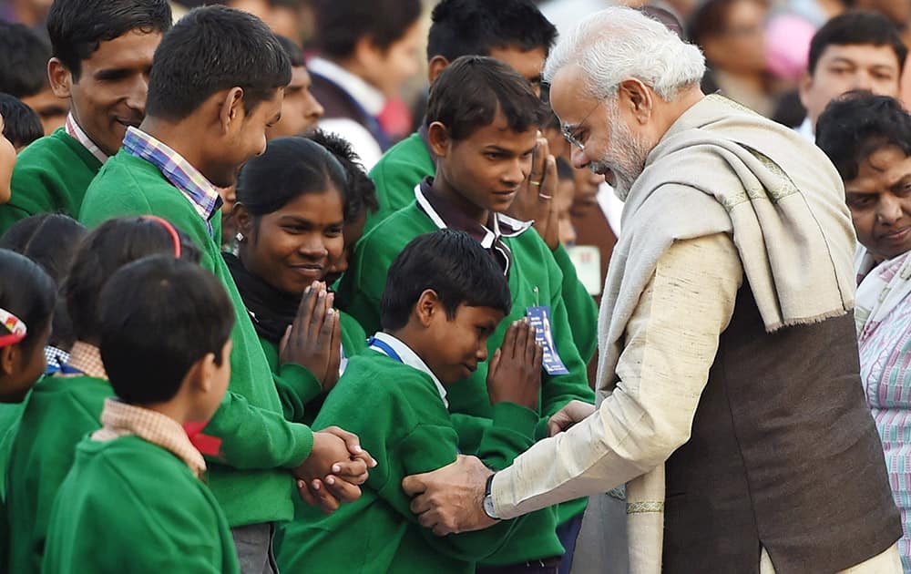 Prime Minister Narendra Modi meeting visually challenged children on the occasion of Mahatma Gandhis death anniversary, at Gandhi Smriti in New Delhi .