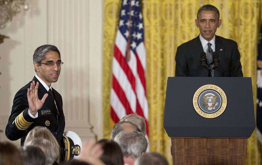 US Surgeon General Vice Admiral Vivek H. Murthy, M.D., M.B.A. stands up as he is acknowledge by President Barack Obama, in the East Room of the White House in Washington.