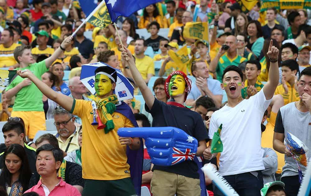 Australian supporters cheer during the AFC Asian Cup final soccer match between South Korea and Australia in Sydney, Australia.