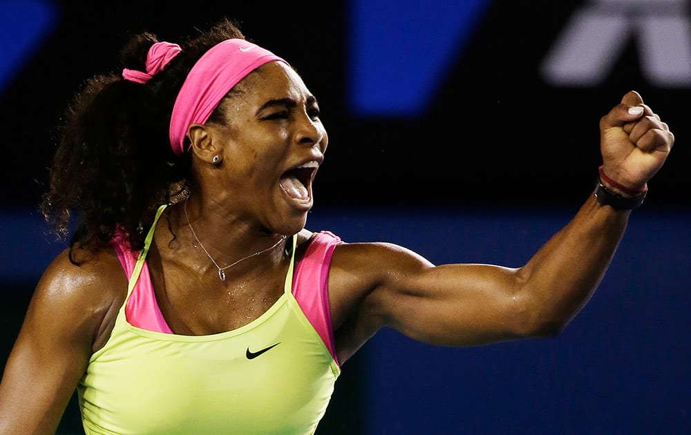 Serena Williams of the US celebrates after winning a point against Maria Sharapova of Russia during the women's singles final at the Australian Open tennis championship in Melbourne.