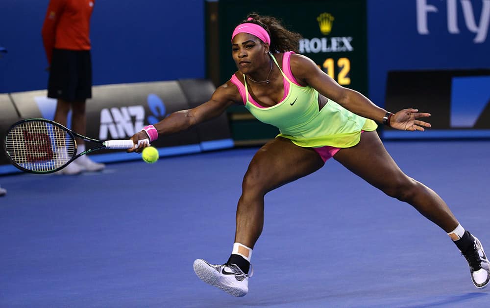 Serena Williams of the stretches out for a return to US Maria Sharapova of Russia during the women's singles final at the Australian Open tennis championship in Melbourne, Australia.