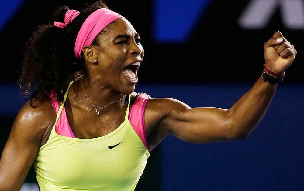 Serena Williams of the US celebrates after winning a point against Maria Sharapova of Russia during the women's singles final at the Australian Open tennis championship in Melbourne.