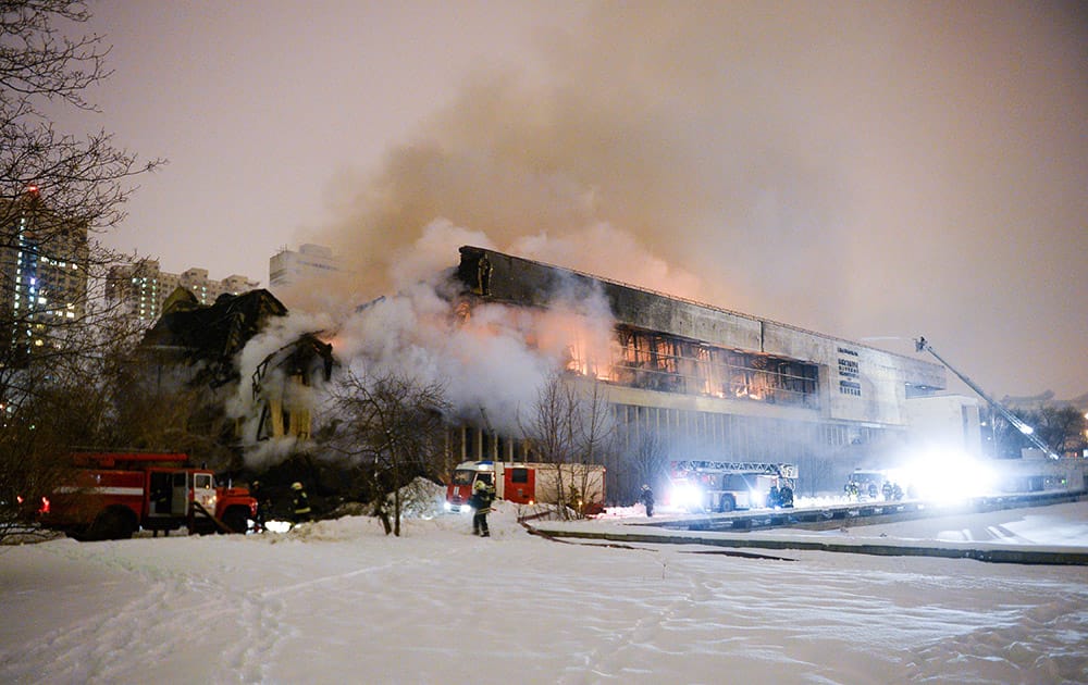 Firefighters put down the blaze at a library of the Russian Academy of Sciences in Moscow.