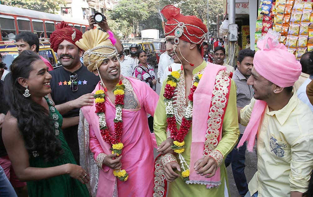 Supporter of the lesbian, gay, bisexual and transgender community dress as grooms of a same-sex marriage during a gay pride parade in Mumbai.