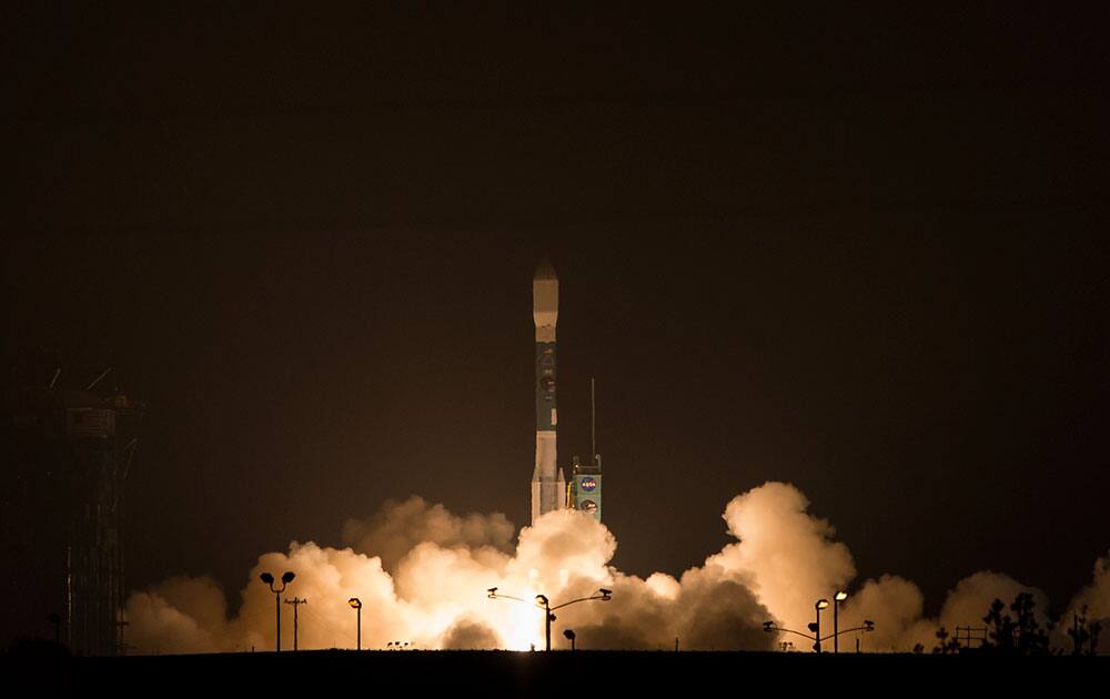 This photo provided by NASA, A Delta 2 rocket carrying the Soil Moisture Active Passive, SMAP ,satellite launches from Vandenberg Air Force Base, Calif. 