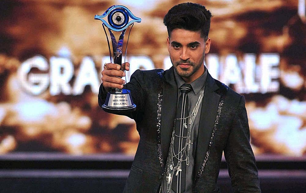 TV actor Gautam Gulati took the Bigg Boss trophy and Rs.50 lakh cash prize after winning the season 8 of celebrity reality show Bigg Boss in Lonavala, Maharashtra.