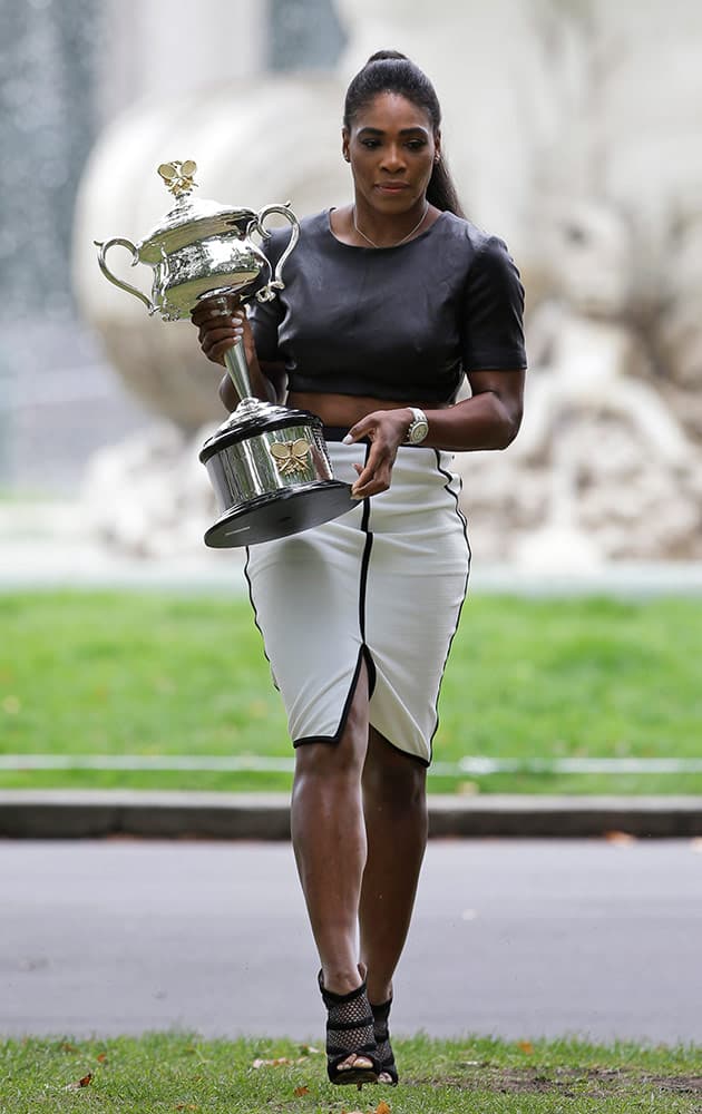 Serena Williams of the U.S. poses with her Australian Open trophy the day after defeating Russia's Maria Sharapova in the women's final at the Australian Open tennis championship in Melbourne, Australia.