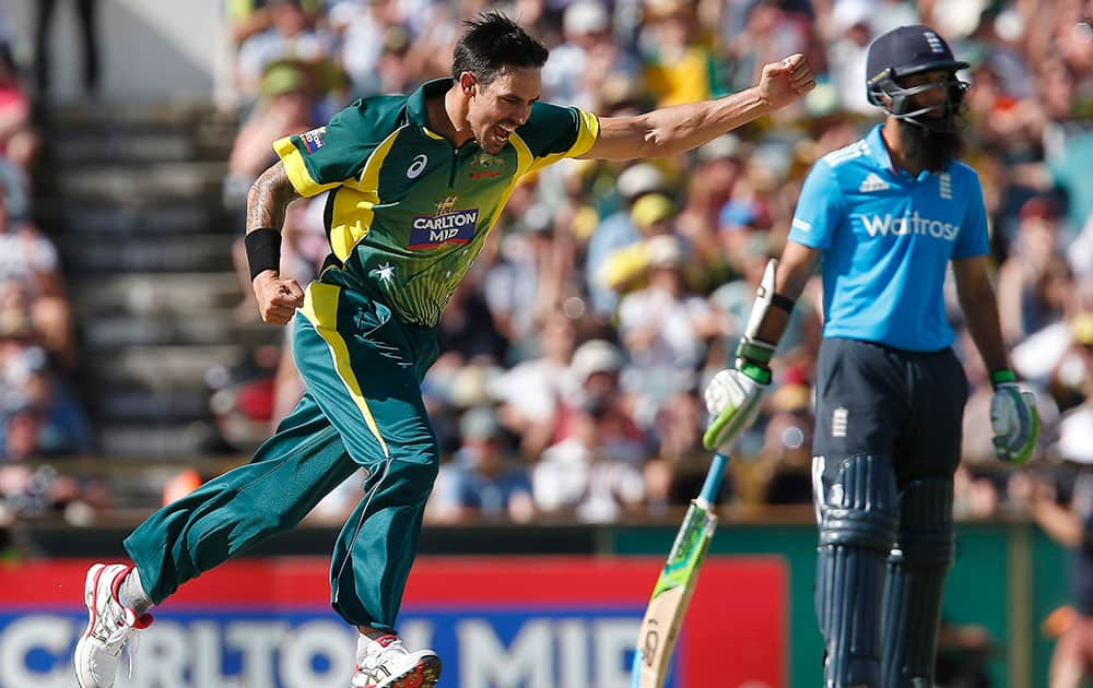 Australia's Mitchell Johnson celebrates after taking the wicket of England's James Taylor during their one day international cricket match in Perth, Australia.