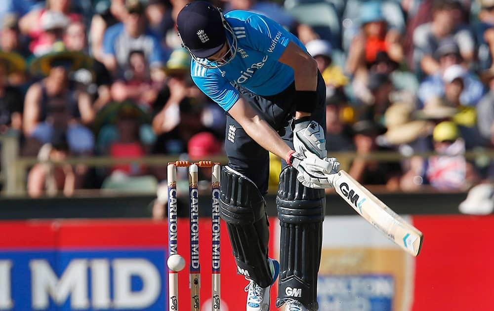 England's Joe Root is trapped lbw off the bowling of Australia's James Faulkner for 6 runs during their one day international cricket match in Perth, Australia.