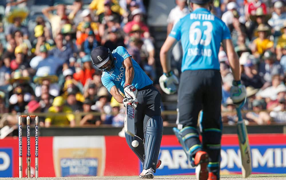 England's Ravi Boparap, left, plays a shot during their one day international cricket match against Australia in Perth, Australia, Sunday.