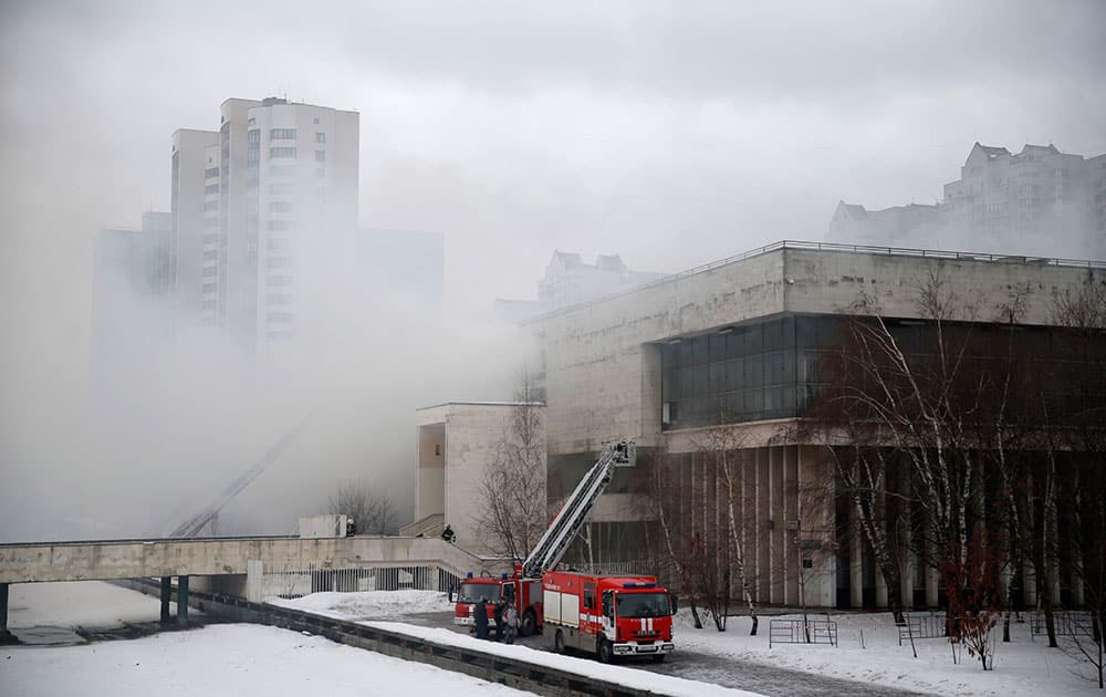 Firefighters work to put out a blaze at a library of the Russian Academy of Sciences in Moscow. A fire at one of Russia's largest libraries has been raging for the second day destroying thousands of rare documents.