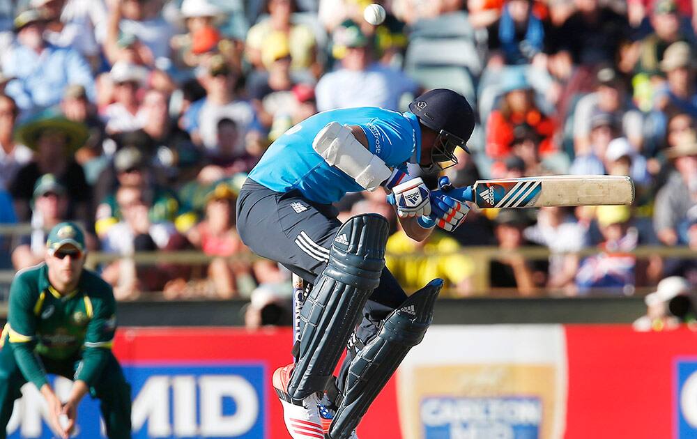 England's Stuart Broad ducks to evade a short pitch ball during their one day international cricket match against Australia, in Perth, Australia.