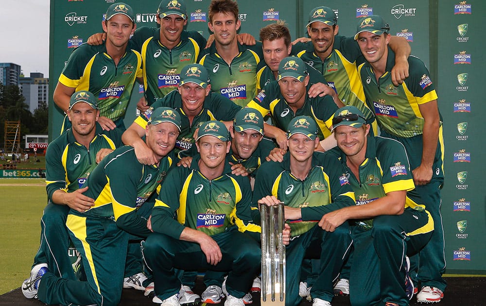 The Australian Team pose for a photo with the trophy after defeating England in the final of their one day international cricket match in Perth, Australia.