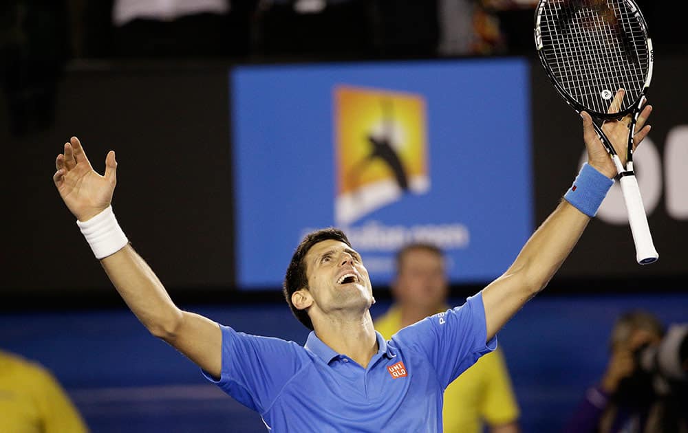 Novak Djokovic of Serbia celebrates after defeating Andy Murray of Britain in the men's singles final at the Australian Open tennis championship in Melbourne, Australia, Sunday.