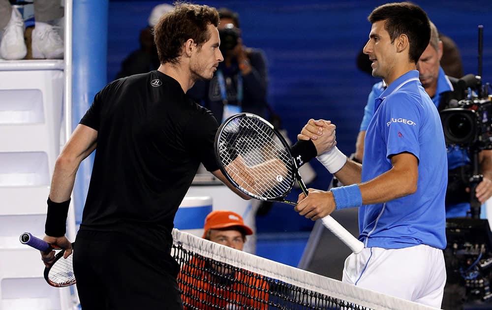 Novak Djokovic of Serbia, right, is congratulated by Andy Murray of Britain after winning the men's singles final at the Australian Open tennis championship in Melbourne, Australia.