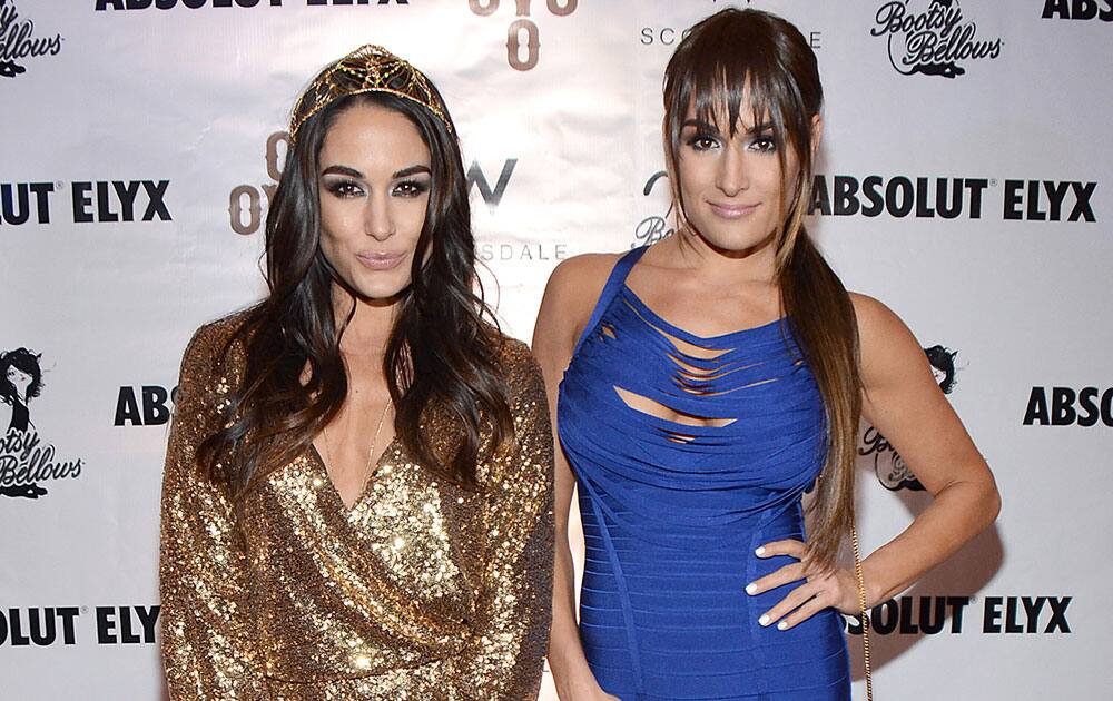 Brie Bella and Nikki Bella arrive at the Pop Up Boosty Bellows at W Scottsdale hosted by Drake in Scottsdale, Ariz.