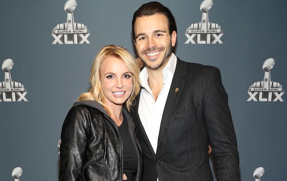 Britney Spears and Charlie Ebersol arrive at the Super Bowl XLIX red carpet in Glendale, Ariz.