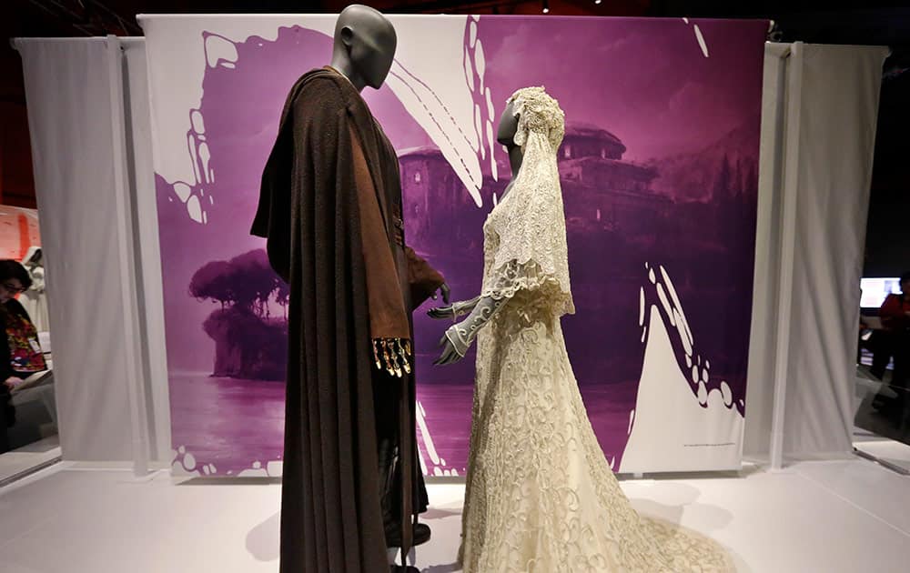 Anakin Skywalker's Jedi robe and the wedding gown of his bride, Padme Amidala, are displayed as part of an exhibit on the costumes of Star Wars at Seattle’s EMP Museum.