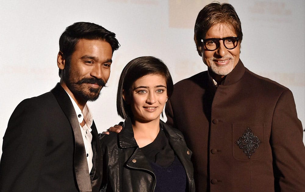 Bollywood actors Amitabh Bachchan, Dhanush and Akshara Haasan pose for photographers during a press conference to promote the movie Shamitabh in New Delhi on Monday.
