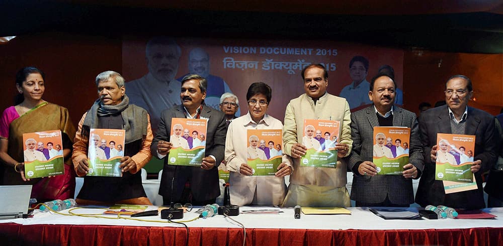 Union Ministers Ananth Kumar, Harsh Vardhan, Nirmala Sitharaman, Delhi BJP President Satish Upadhyay along with BJP CM candidate Kiran Bedi releasing the partys Vision Document for Delhi Assembly election 2015, in New Delhi.