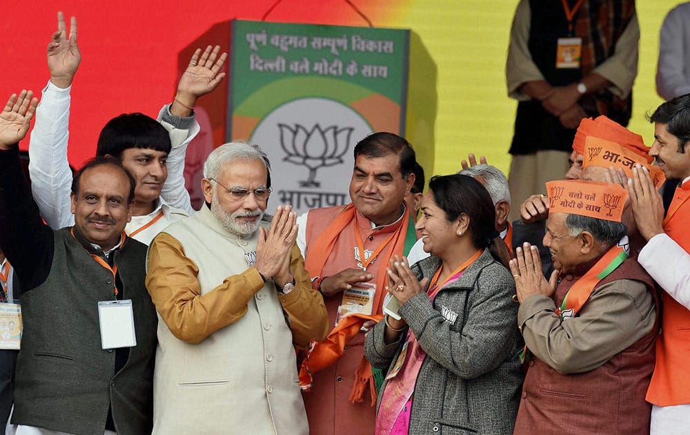 Prime Minister Narendra Modi with BJP leaders at an election rally for the upcoming Assembly polls, at Rohini in New Delhi.
