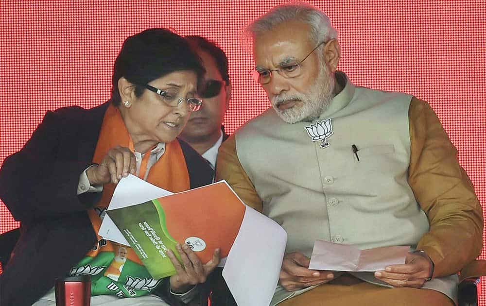 Prime Minister Narendra Modi with BJP CM candidate Kiran Bedi at an election rally for the upcoming Assembly polls, at Rohini in New Delhi.