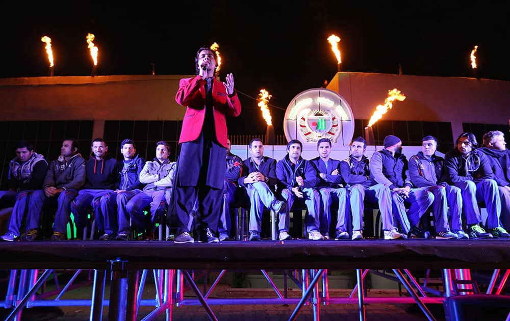 An Afghan singer performs during a farewell ceremony at Kabul cricket academy, in Kabul, Afghanistan.