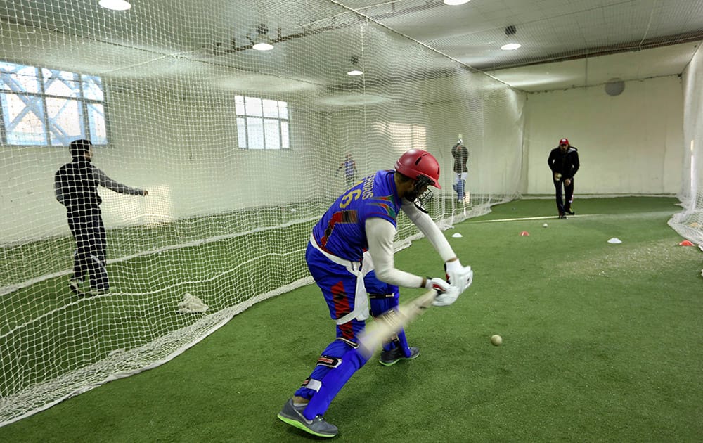 Afghan cricket player Mirwais Ashraf trains at Kabul cricket academy training center, in Kabul, Afghanistan.