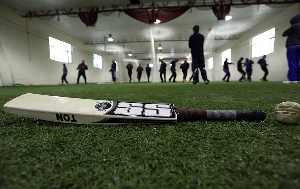 Afghan cricket players practice at the Kabul cricket academy training center, in Kabul, Afghanistan.