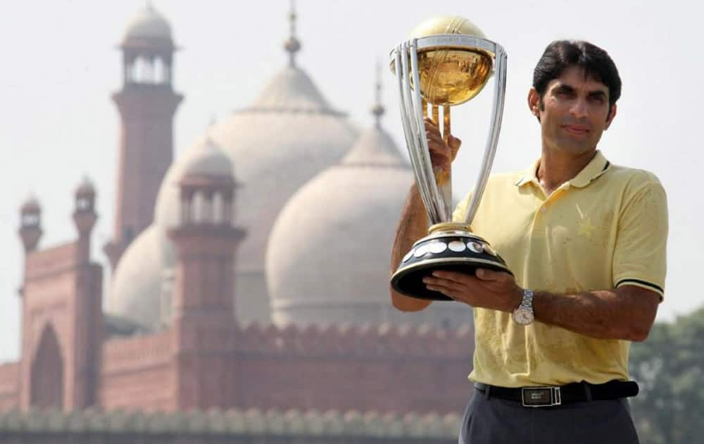 Pakistan captain Misbah-ul-Haq holds the cricket World Cup 2015 trophy in front of the historical Badshahi Mosque in Lahore, Pakistan. 