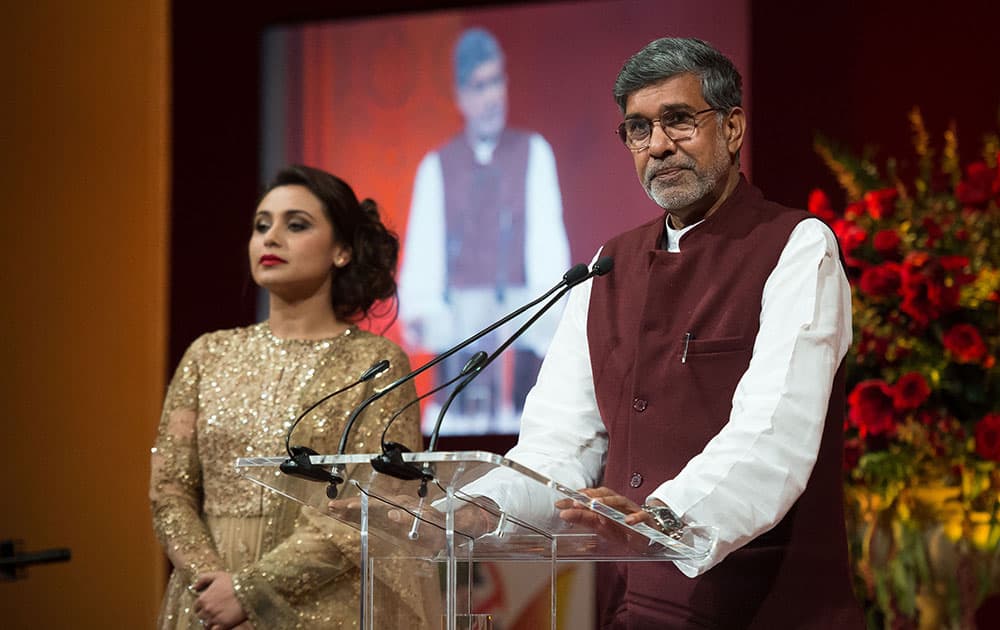 Bollywood actress Rani Mukerji and Indian child rights activist and 2014 Nobel Peace Prize winner Kailash Satyarthi address guests at the British Asian Trust dinner in central London.