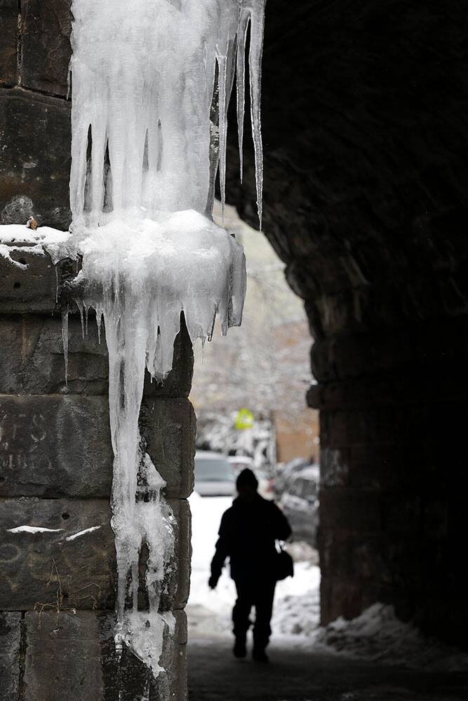 Icicles hang off a pedestrian tunnel in the East Harlem section of New York