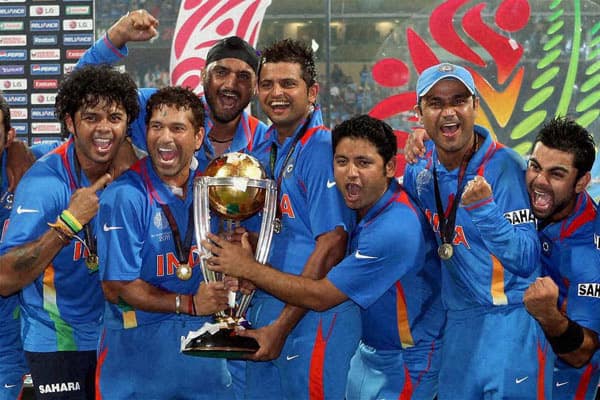 Indian players jubilate with the trophy after winning the 2011 Cricket World Cup in Mumbai.