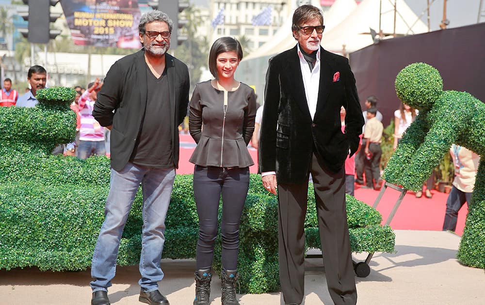 Bollywood superstar Amitabh Bachchan, poses with co-star Akshara Haasan and director R. Balakrishnan at an event to promote his film 'Shamitabh' in the sidelines of a motor show in Mumbai.