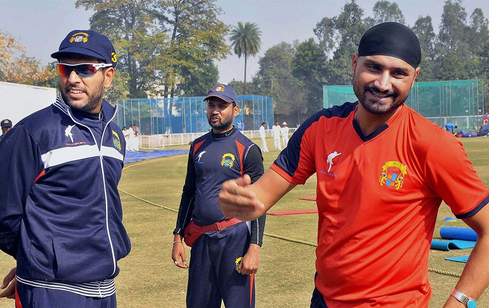 Cricketers Harbhajan Singh and Yuvraj Singh at a practice session.