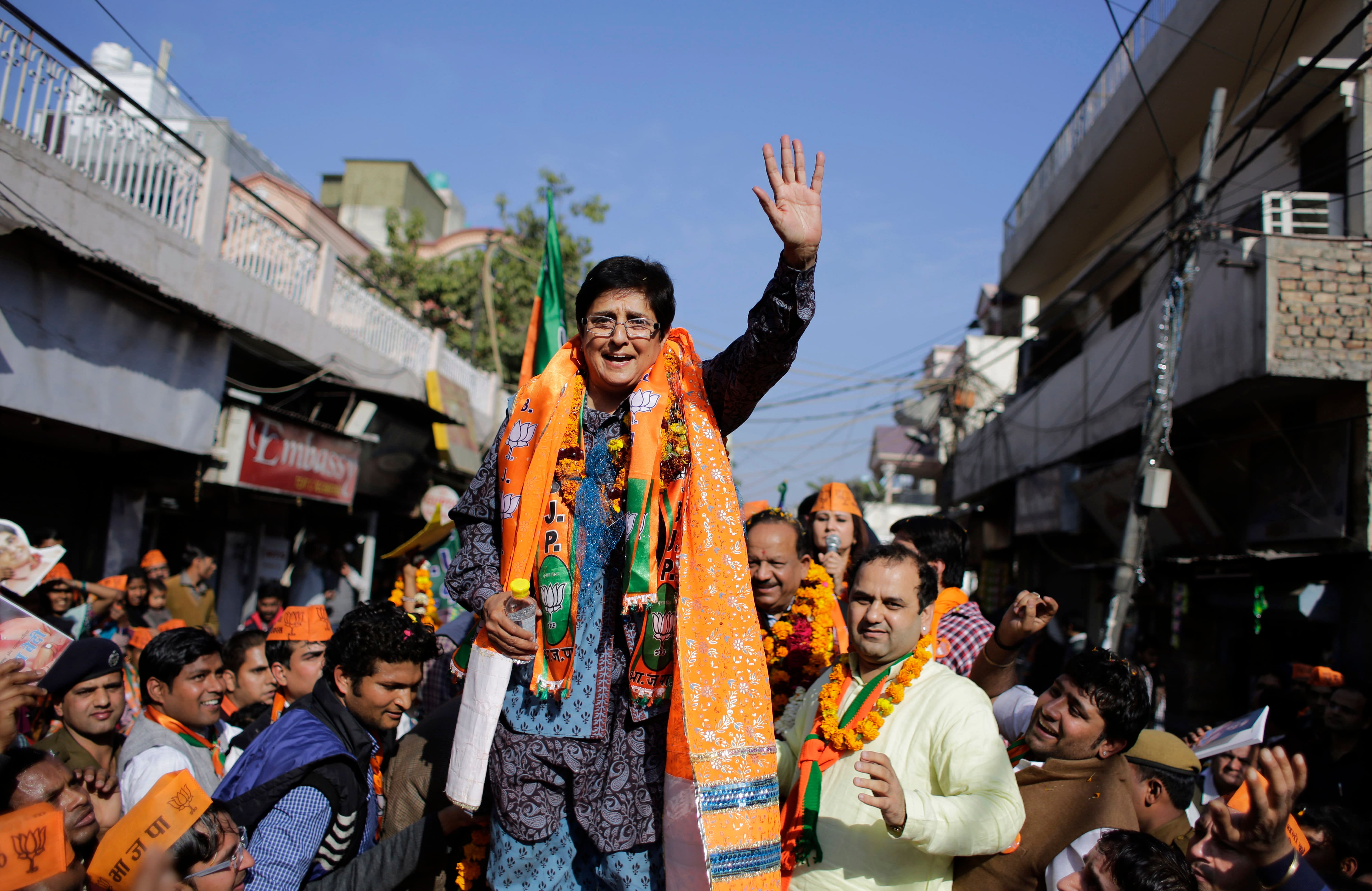 Bharatiya Janata Party (BJP) chief ministerial candidate Kiran Bedi waves to supporters during an election campaign rally ahead of Delhi state election in New Delhi.