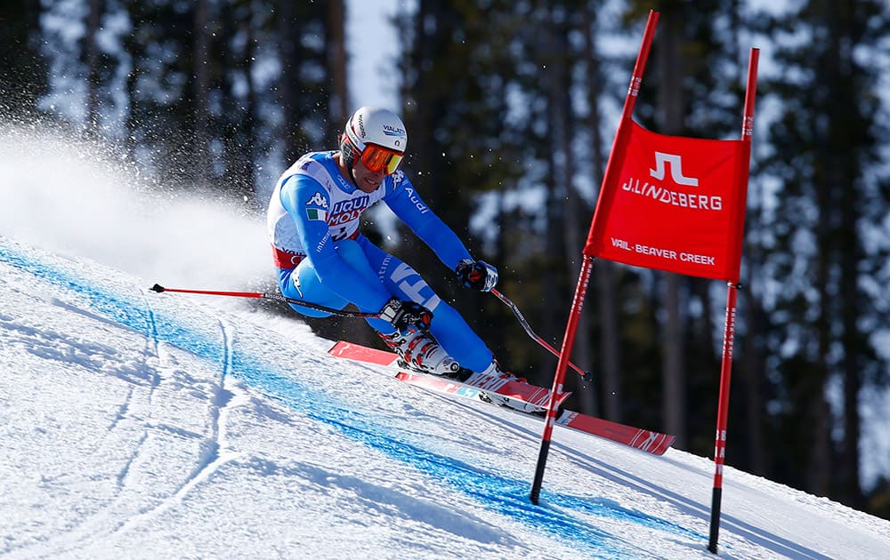 Italy's Matteo Marsaglia races down the course during the men's super-G competition at the alpine skiing world championships, in Beaver Creek, Colo.