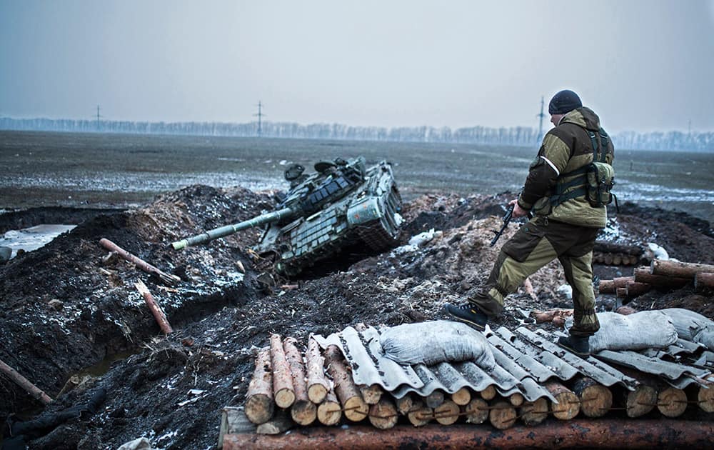 A pro-Russian rebel guards captured former Ukrainian Army checkpoint outside Vuhlehirsk, Donetsk region, eastern Ukraine.